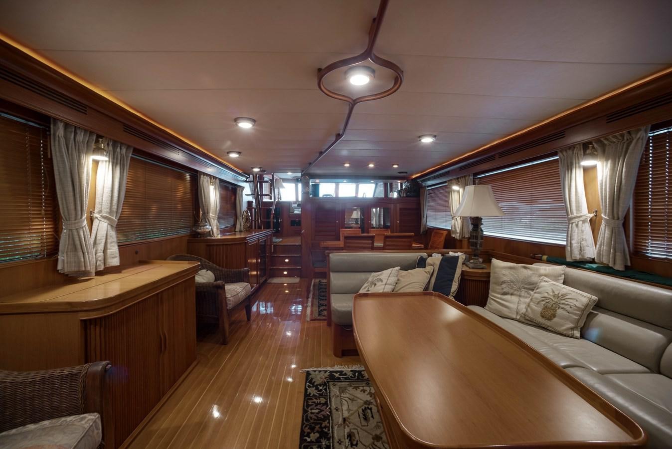 a room with a bed and a desk aboard BLUE ROSY V Yacht for Sale