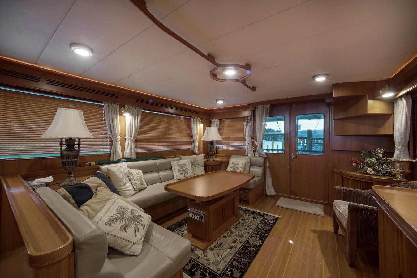 a living room with a couch and a table aboard BLUE ROSY V Yacht for Sale