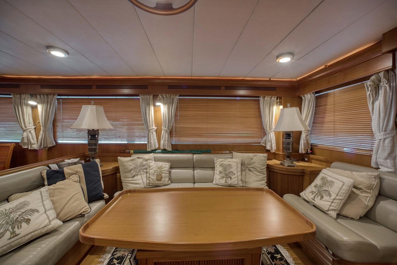 a living room with a couch and a table aboard BLUE ROSY V Yacht for Sale