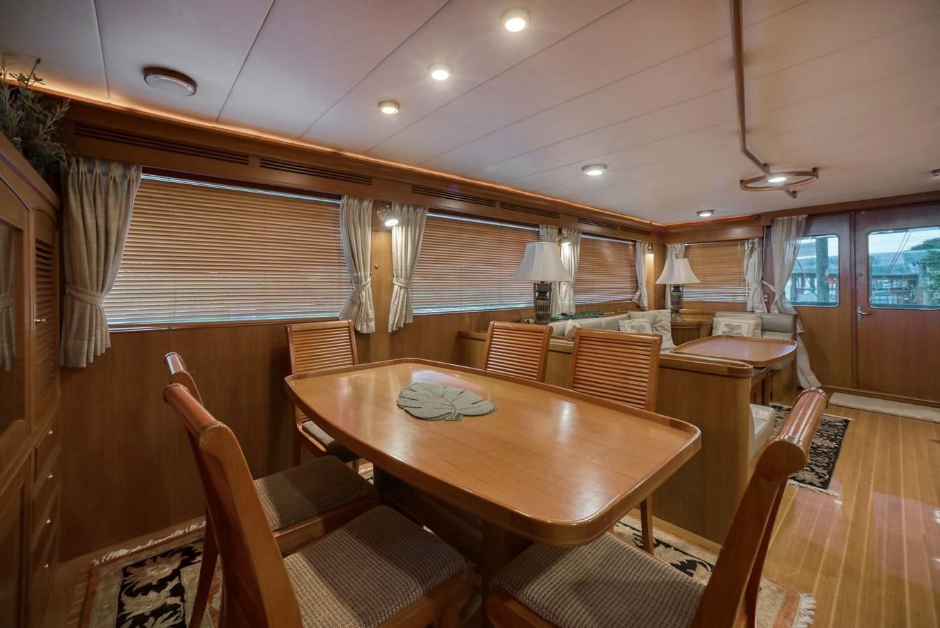 a dining table in a room aboard BLUE ROSY V Yacht for Sale