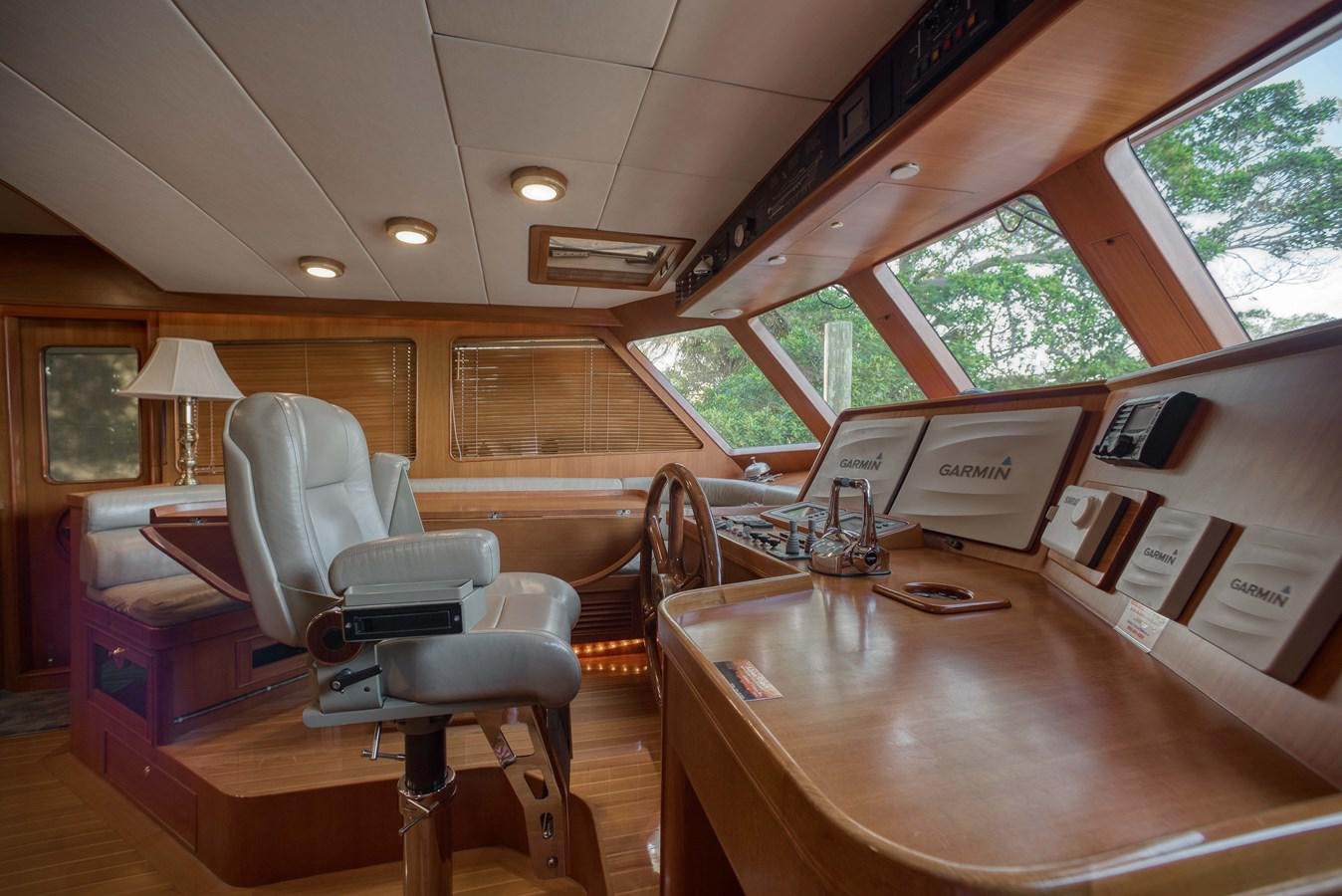 a room with a table and chairs aboard BLUE ROSY V Yacht for Sale