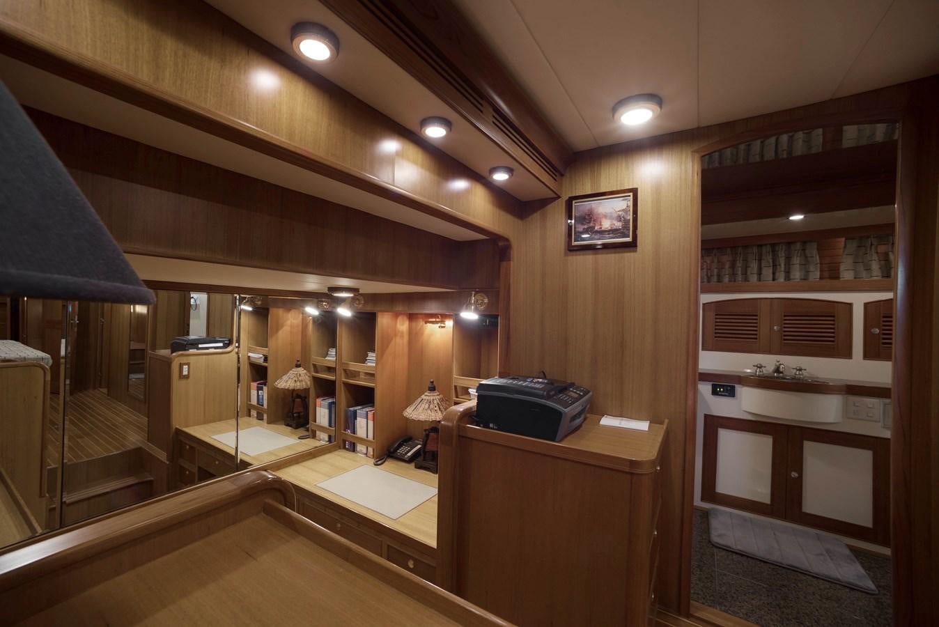 a room with a desk and a television aboard BLUE ROSY V Yacht for Sale