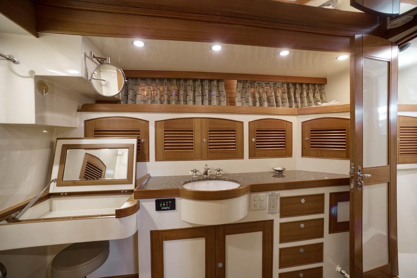 a bathroom with a sink and cabinets aboard BLUE ROSY V Yacht for Sale
