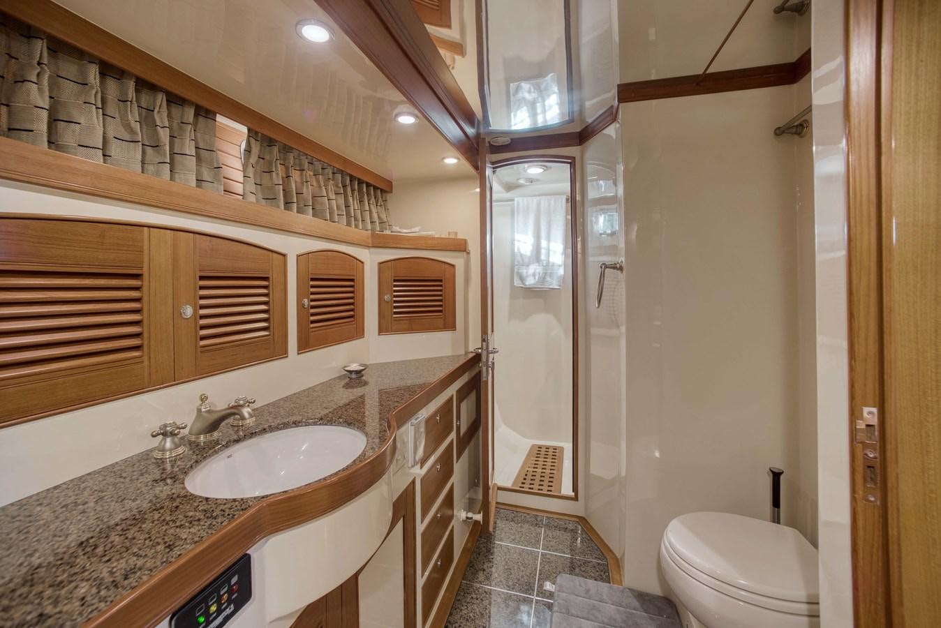 a bathroom with a sink and a toilet aboard BLUE ROSY V Yacht for Sale