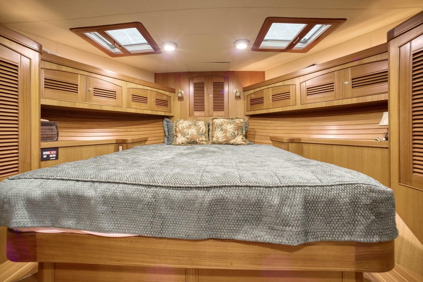 a bed in a cabin aboard BLUE ROSY V Yacht for Sale