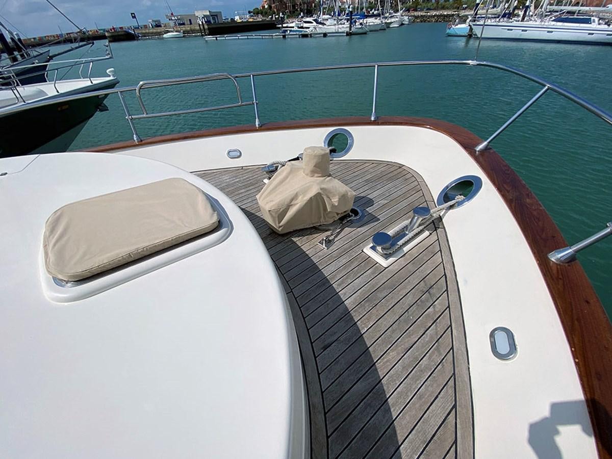 a boat with a seat on the deck aboard SPEED 5 Yacht for Sale