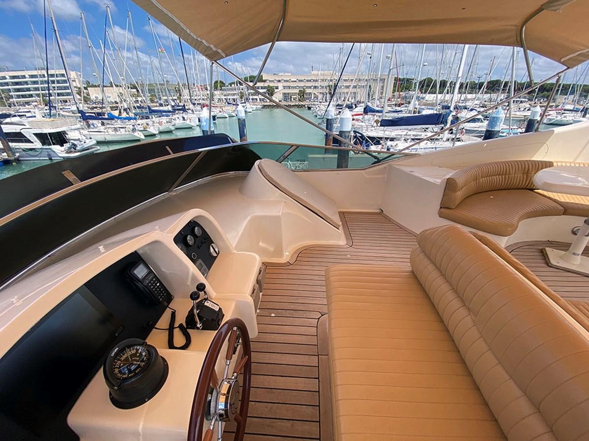 a deck with a view of a city and water aboard SPEED 5 Yacht for Sale