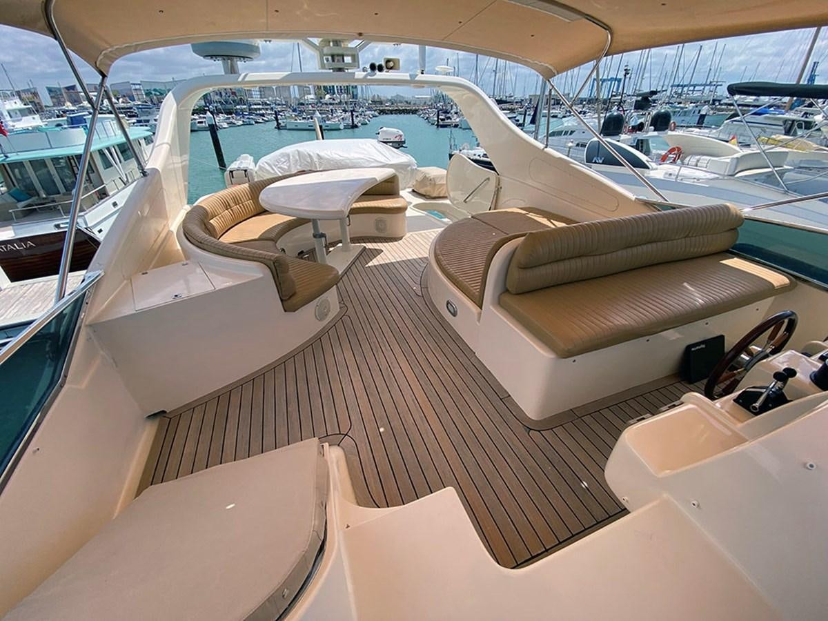 a boat with a bench seat aboard SPEED 5 Yacht for Sale