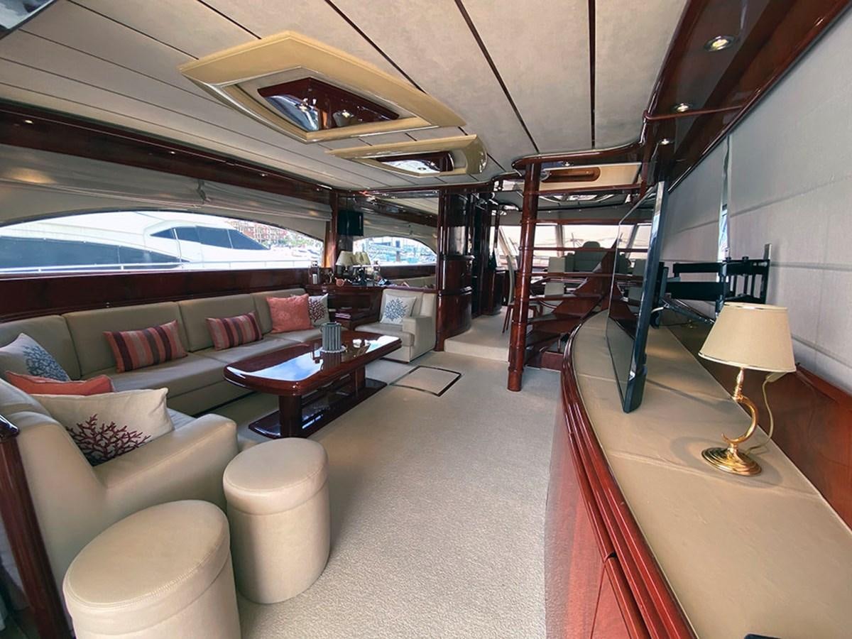 a room with a couch and a table aboard SPEED 5 Yacht for Sale