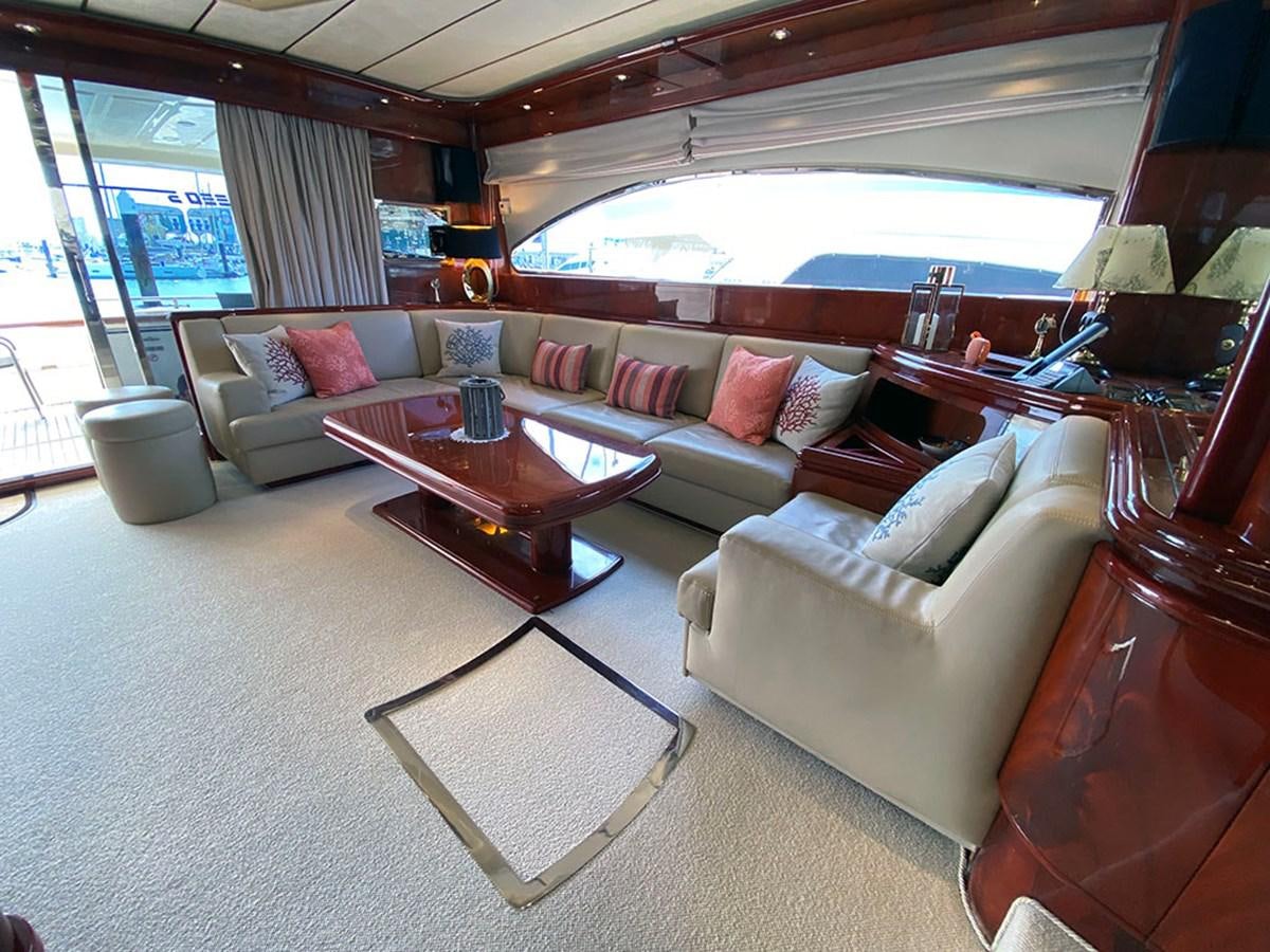 a living room with a large window aboard SPEED 5 Yacht for Sale