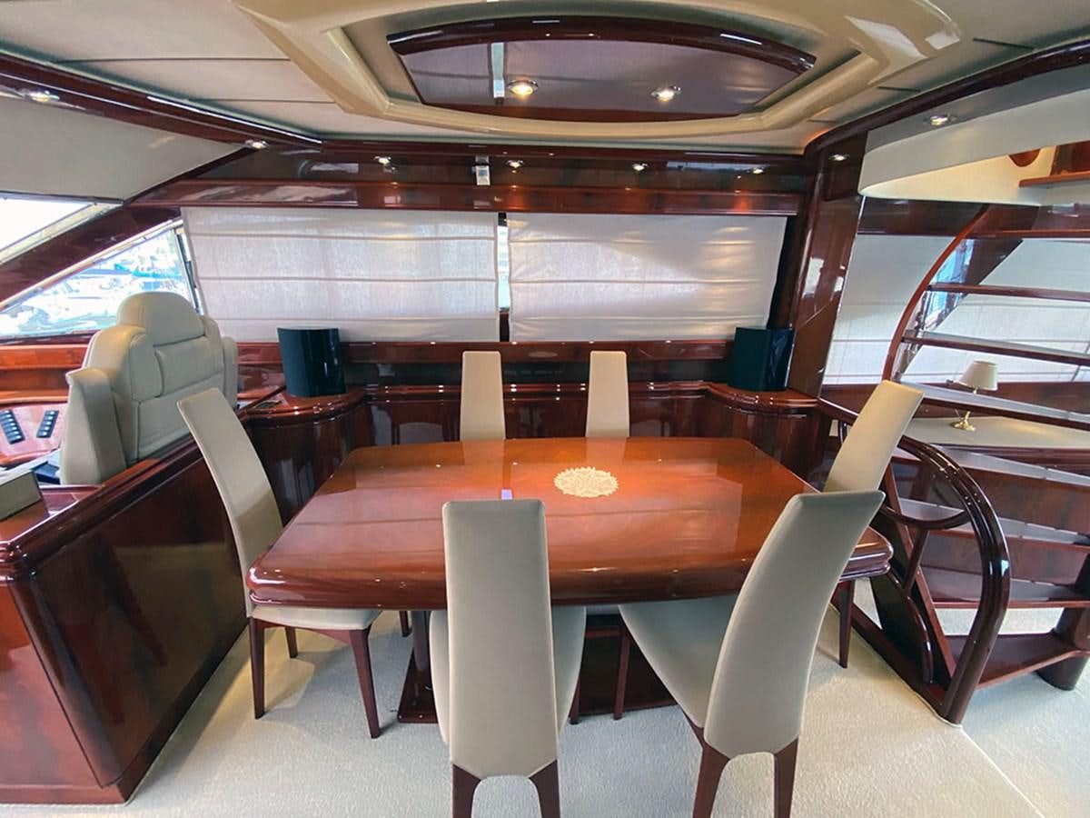 a room with chairs and tables aboard SPEED 5 Yacht for Sale
