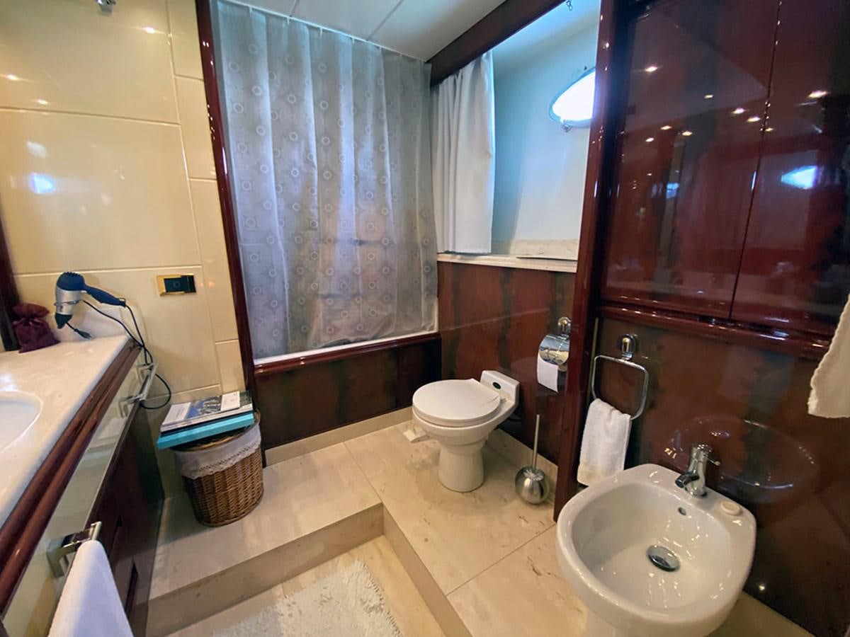 a bathroom with a sink toilet and a bathtub aboard SPEED 5 Yacht for Sale