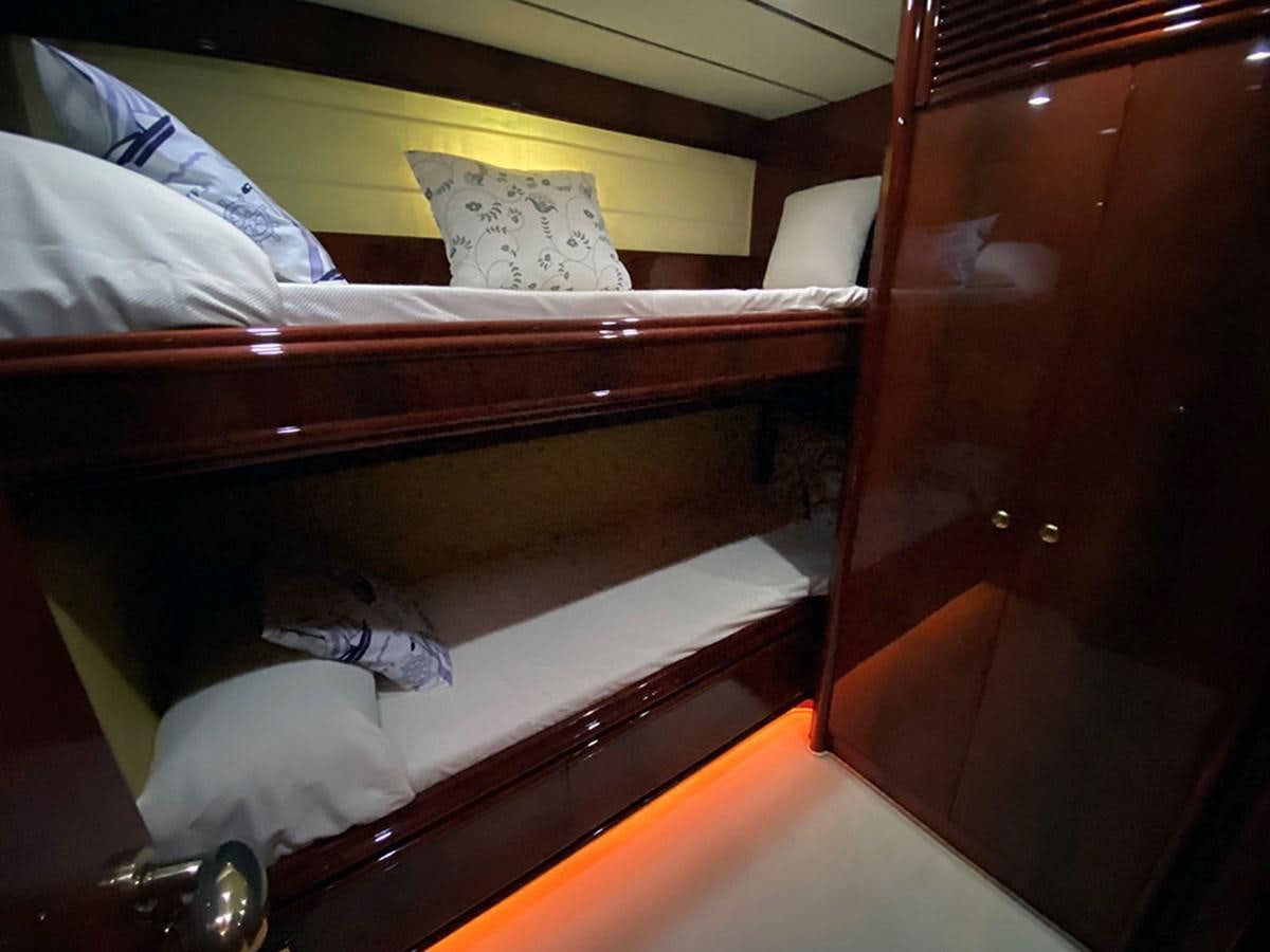 a bed with a white pillow aboard SPEED 5 Yacht for Sale