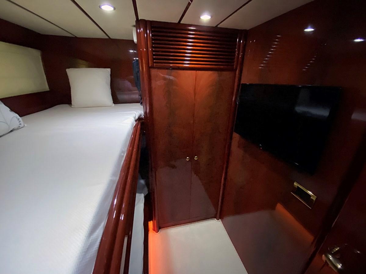 a bed with a wooden headboard aboard SPEED 5 Yacht for Sale