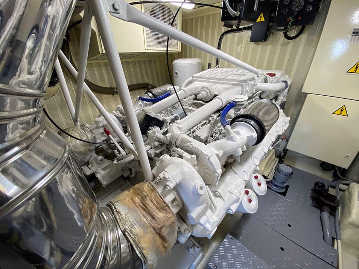 a person working on a machine aboard SPEED 5 Yacht for Sale