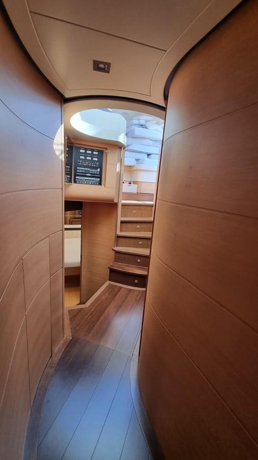 a view of a hallway with a computer on the wall aboard GUSS 97 Yacht for Sale