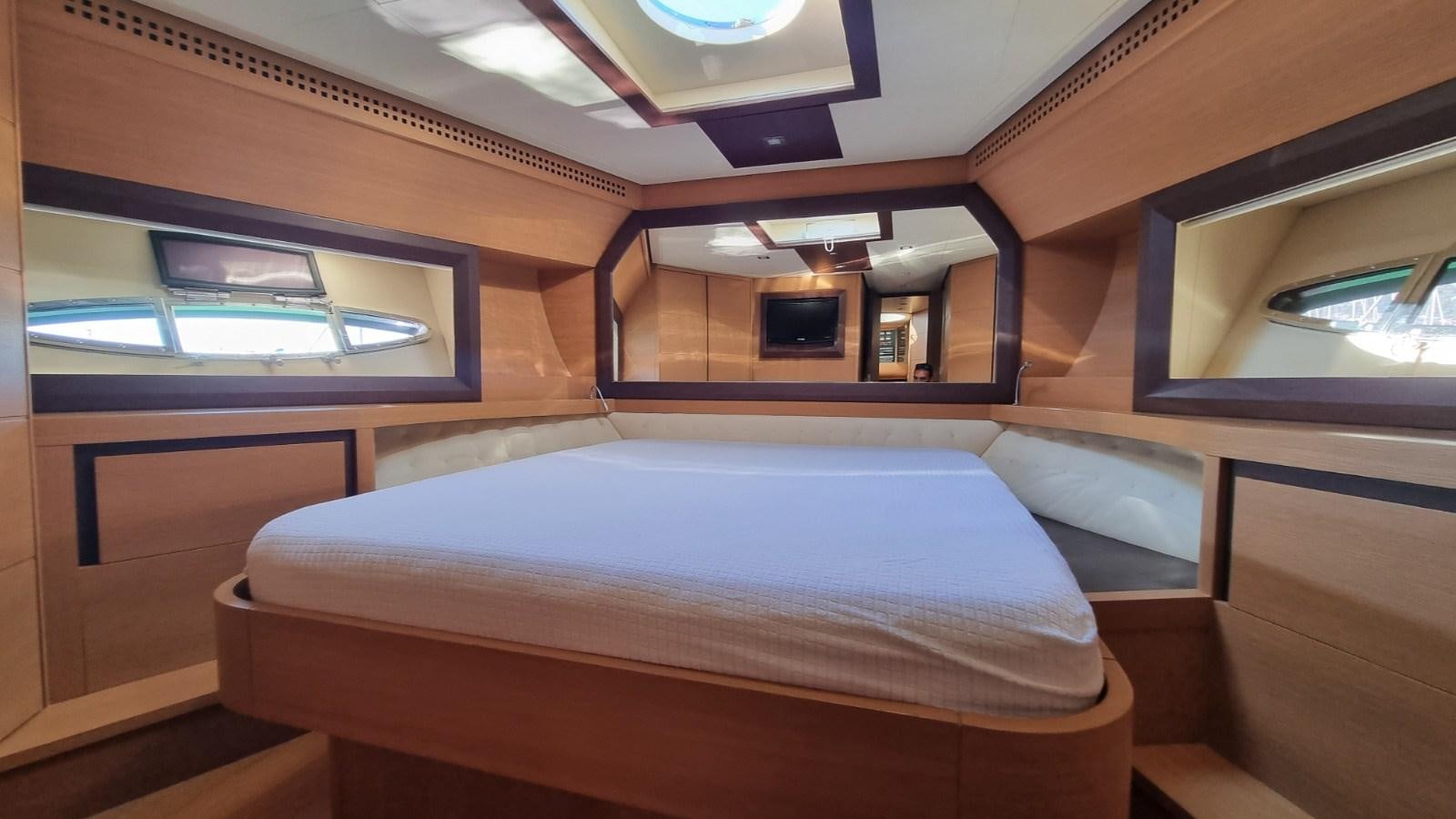 a room with a bed and a window aboard GUSS 97 Yacht for Sale