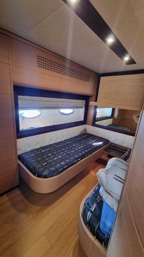 a room with a large bed aboard GUSS 97 Yacht for Sale