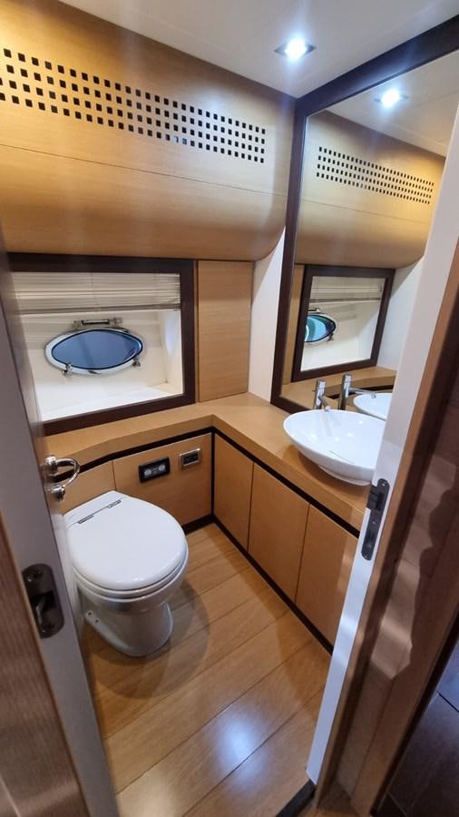 a bathroom with a sink and a toilet aboard GUSS 97 Yacht for Sale
