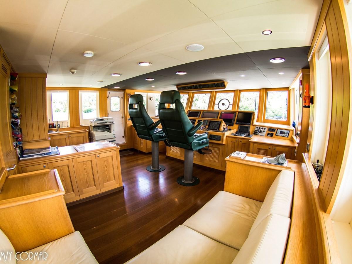 a room with a couch and chairs aboard cormar Yacht for Sale