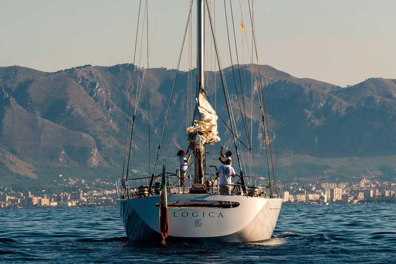 a couple of people on a sailboat in the water aboard LOGICA Yacht for Sale