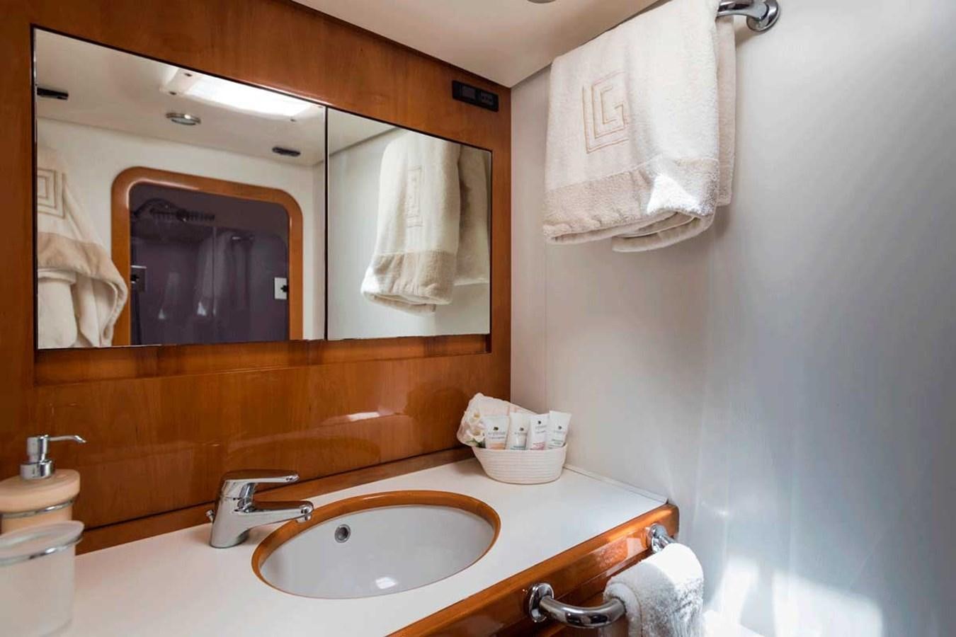 a bathroom with a sink and a mirror aboard LOGICA Yacht for Sale