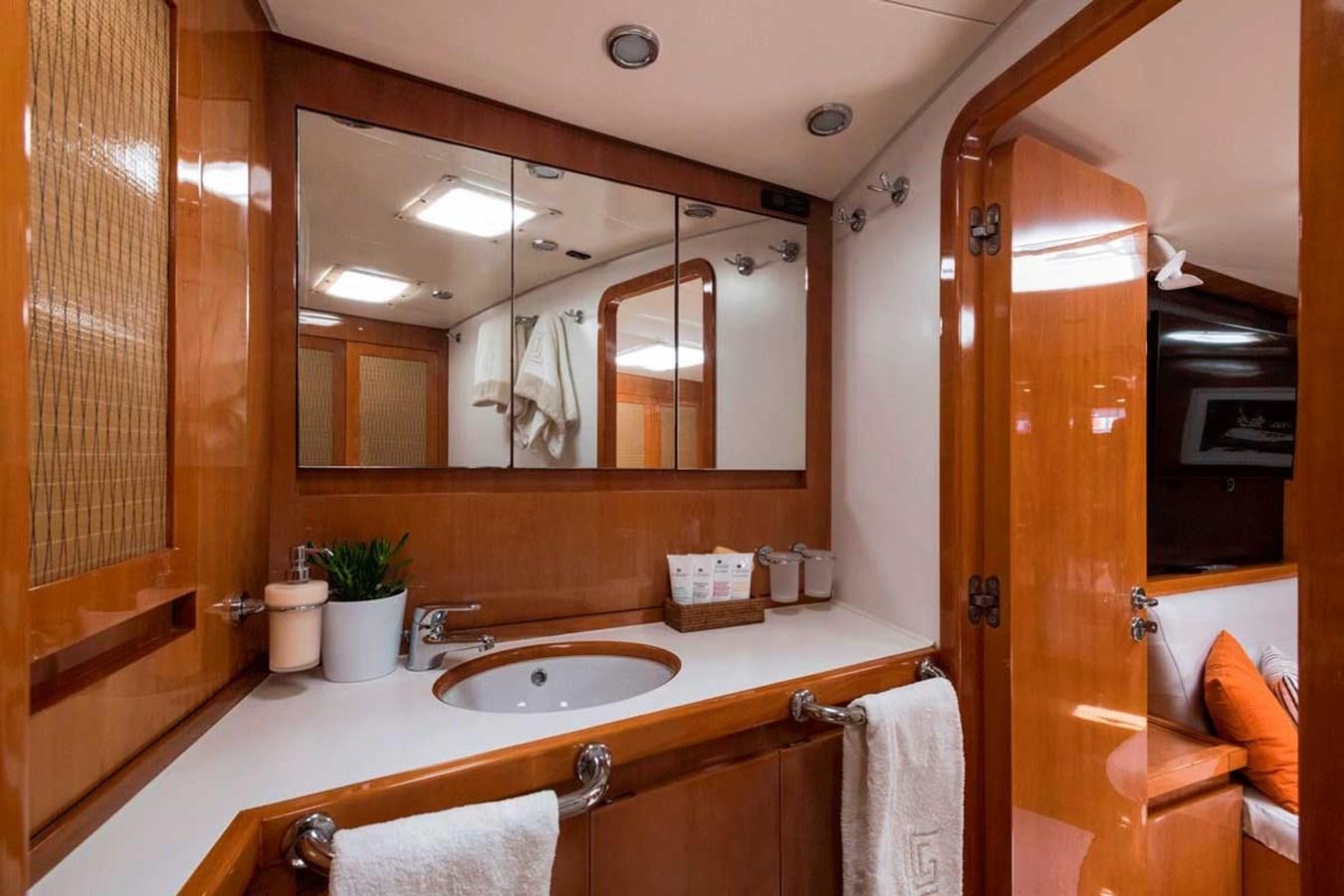 a bathroom with a large mirror aboard LOGICA Yacht for Sale