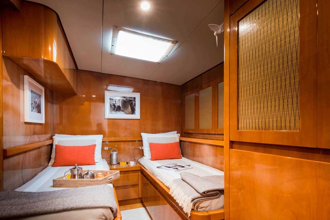a room with a couple beds aboard LOGICA Yacht for Sale