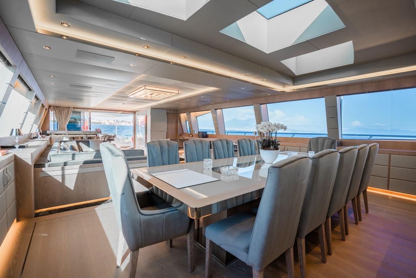 a large dining room with a large table and chairs aboard AAA Yacht for Sale