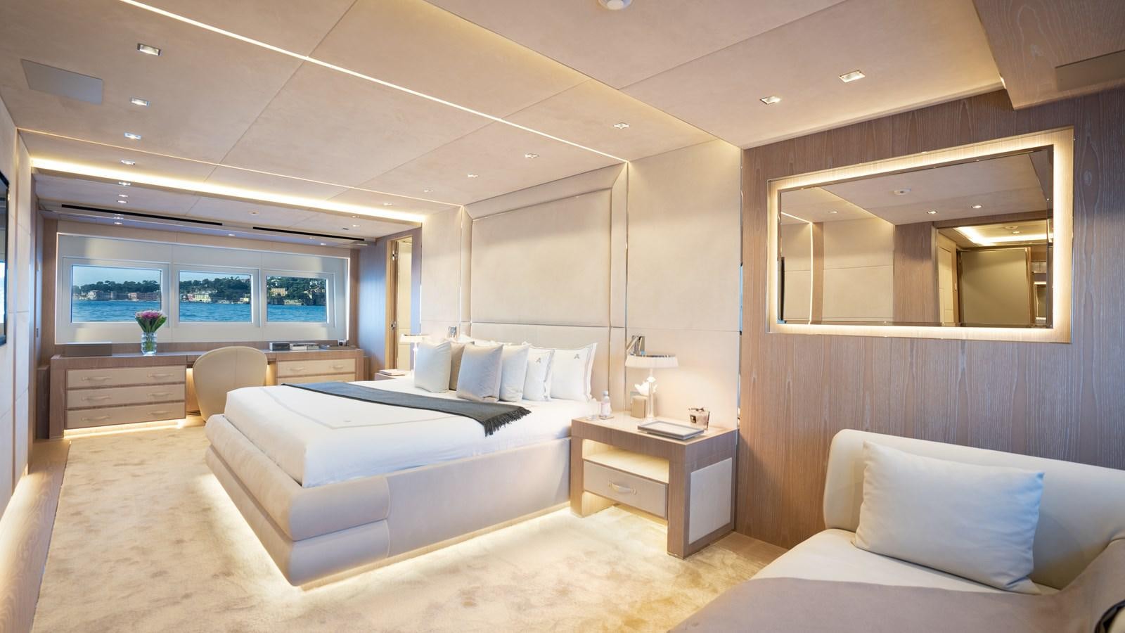 a room with a bed and a desk aboard AAA Yacht for Sale
