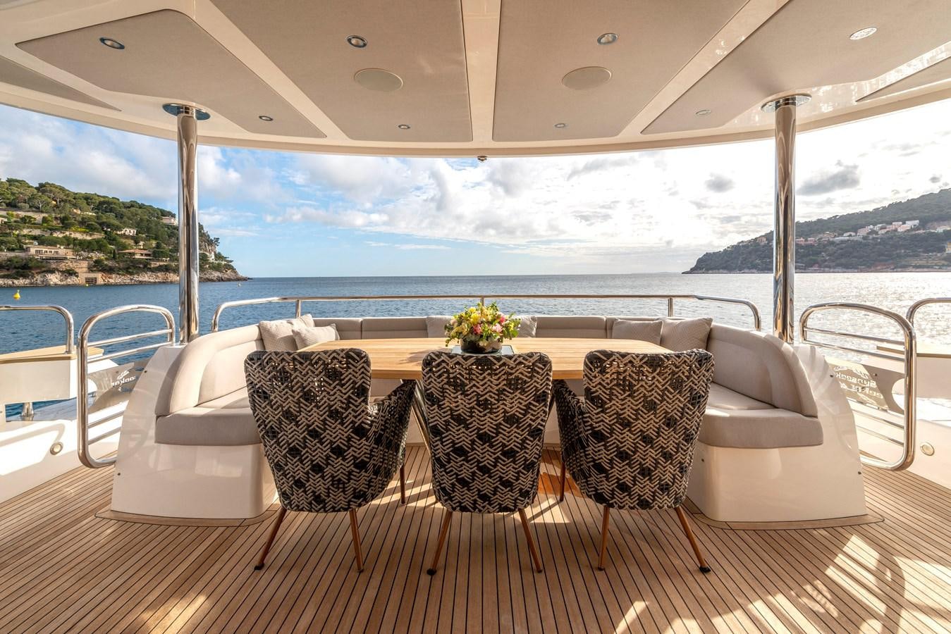 a table with chairs on it aboard TAKE OFF Yacht for Sale