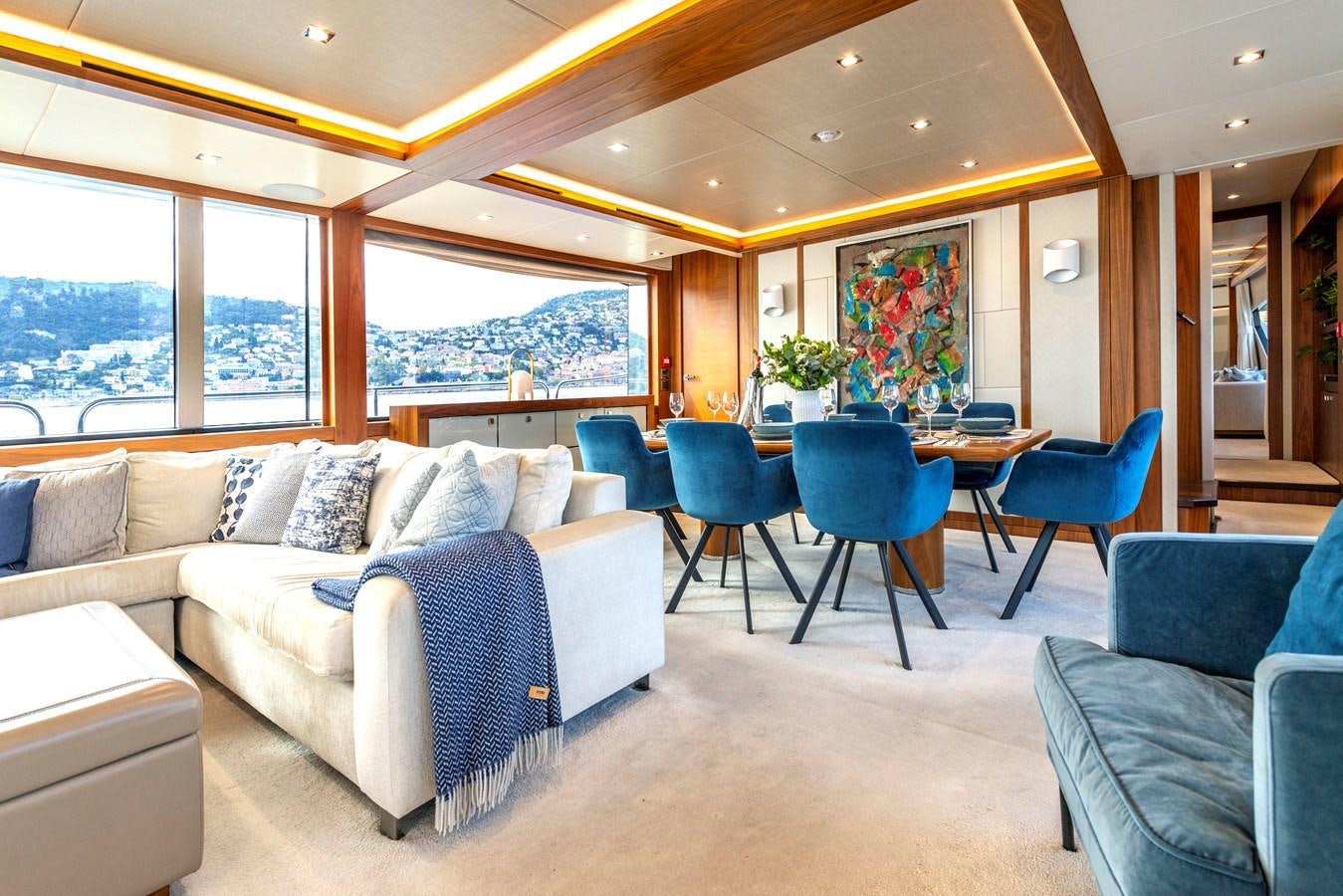 a living room with a couch and a table aboard TAKE OFF Yacht for Sale