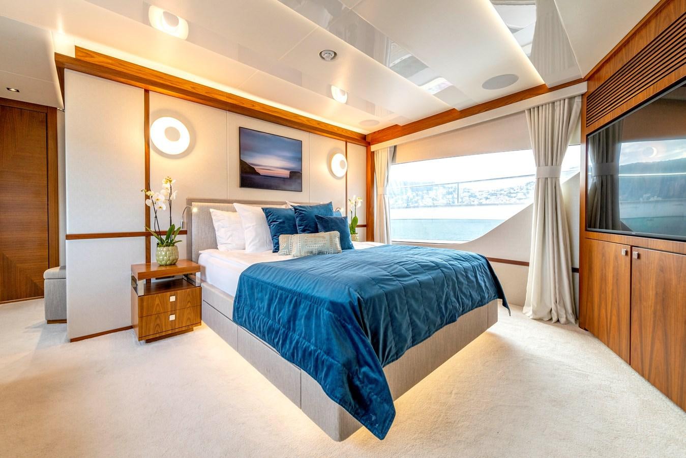 a bedroom with a large bed aboard TAKE OFF Yacht for Sale