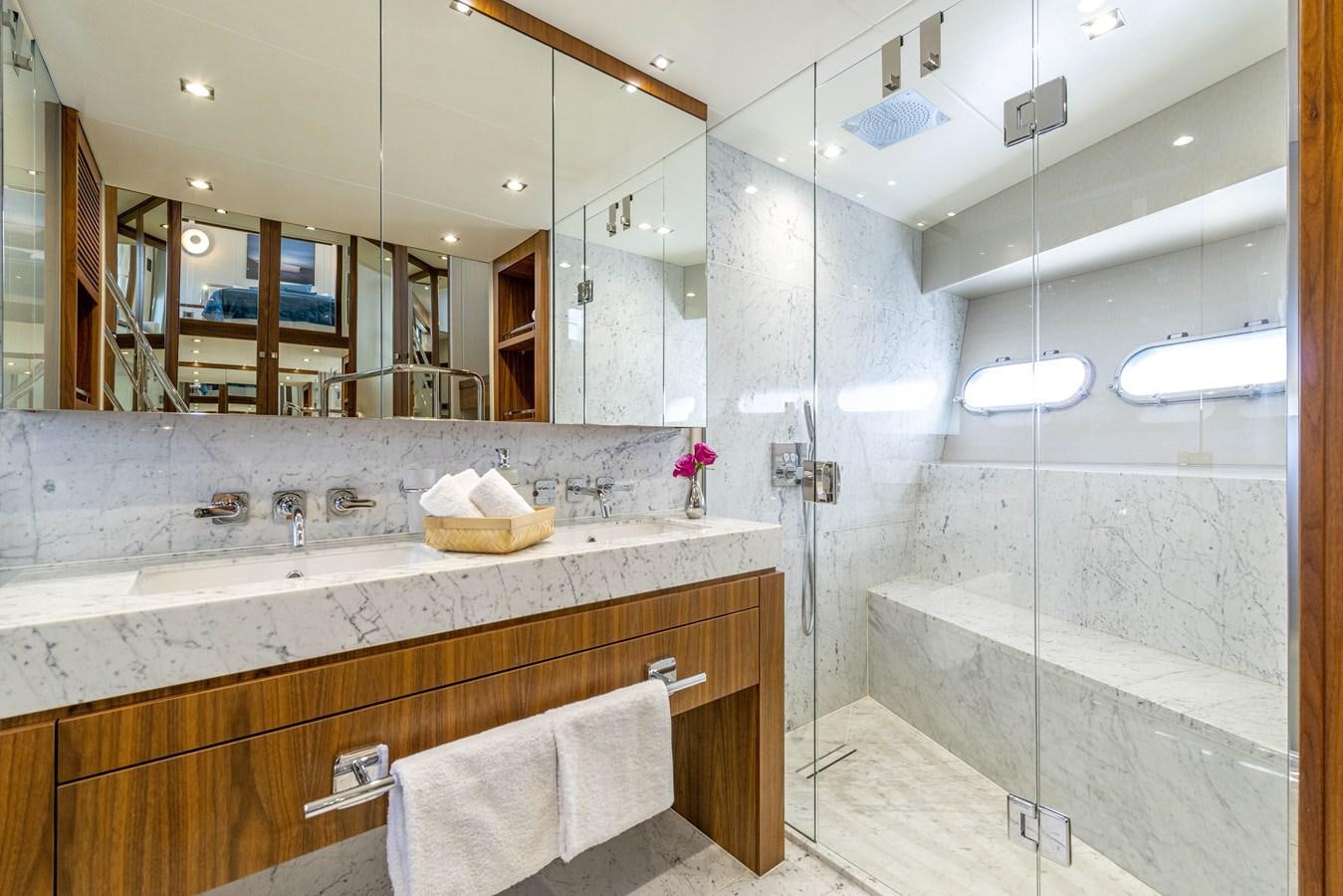 a bathroom with a large mirror aboard TAKE OFF Yacht for Sale