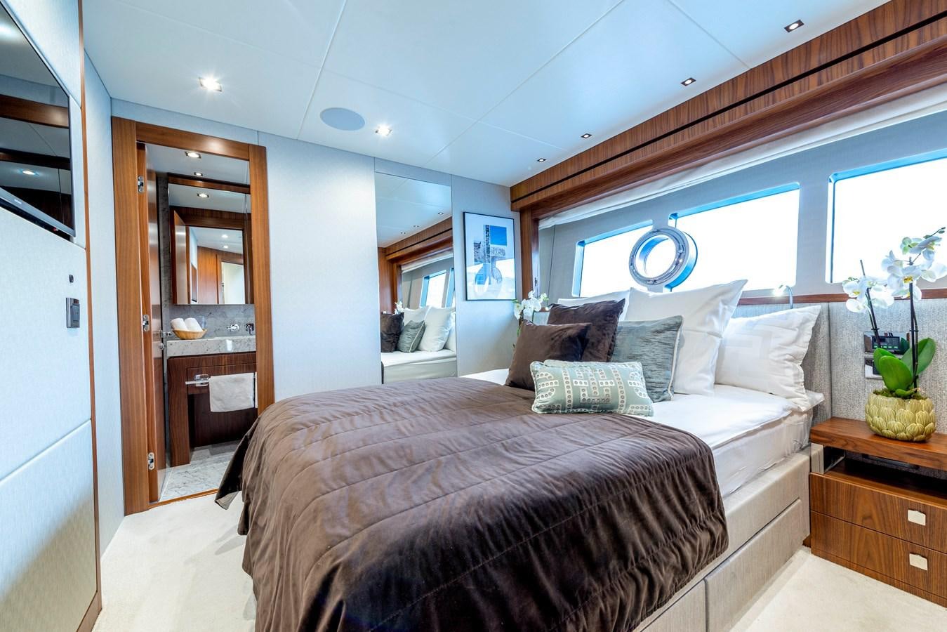 a bedroom with a large bed aboard TAKE OFF Yacht for Sale