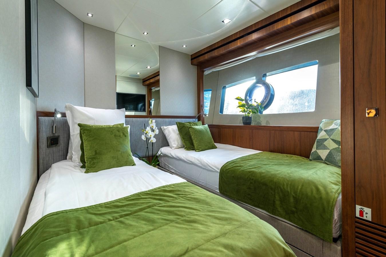 a couple of beds in a room aboard TAKE OFF Yacht for Sale