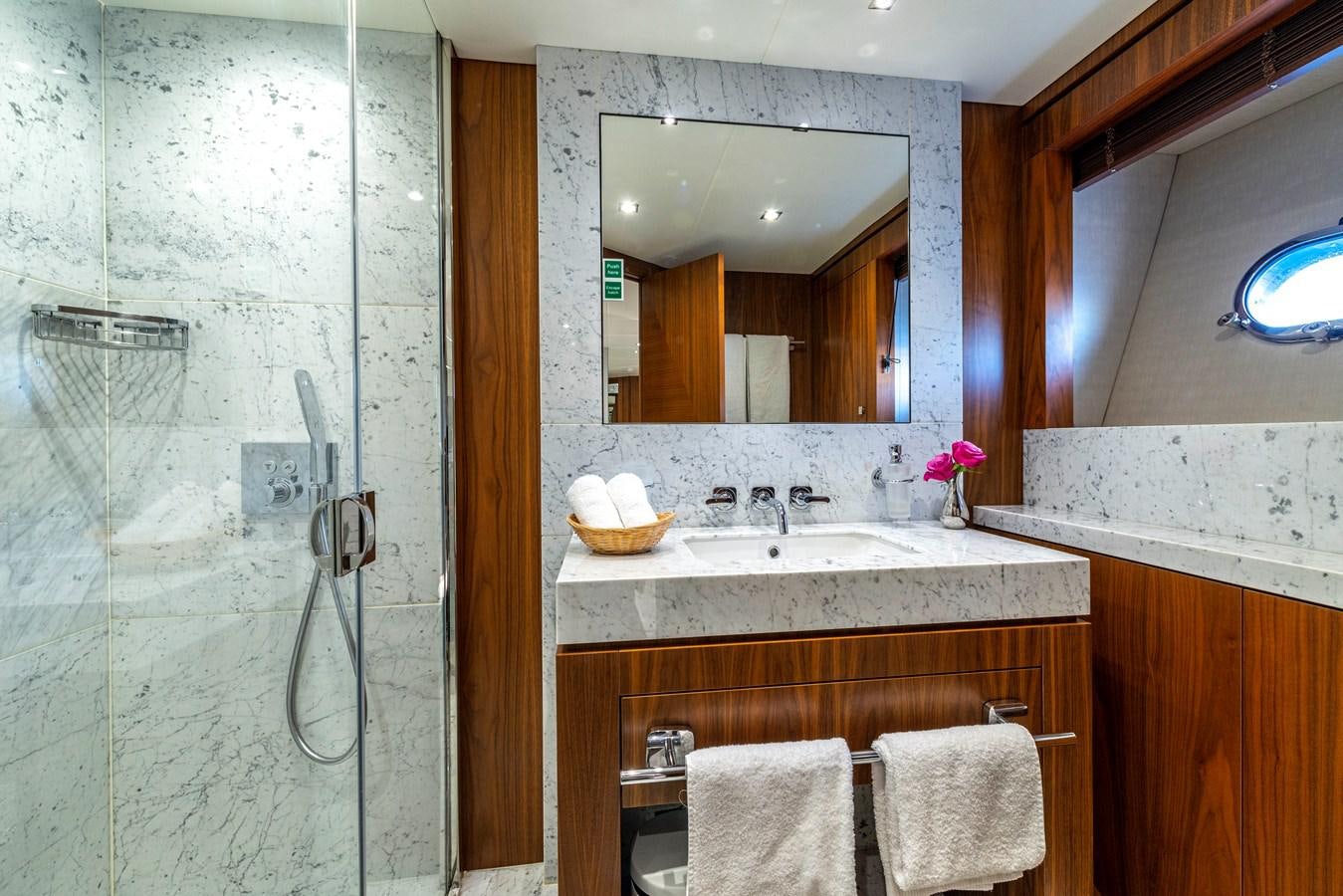 a bathroom with a sink and a mirror aboard TAKE OFF Yacht for Sale
