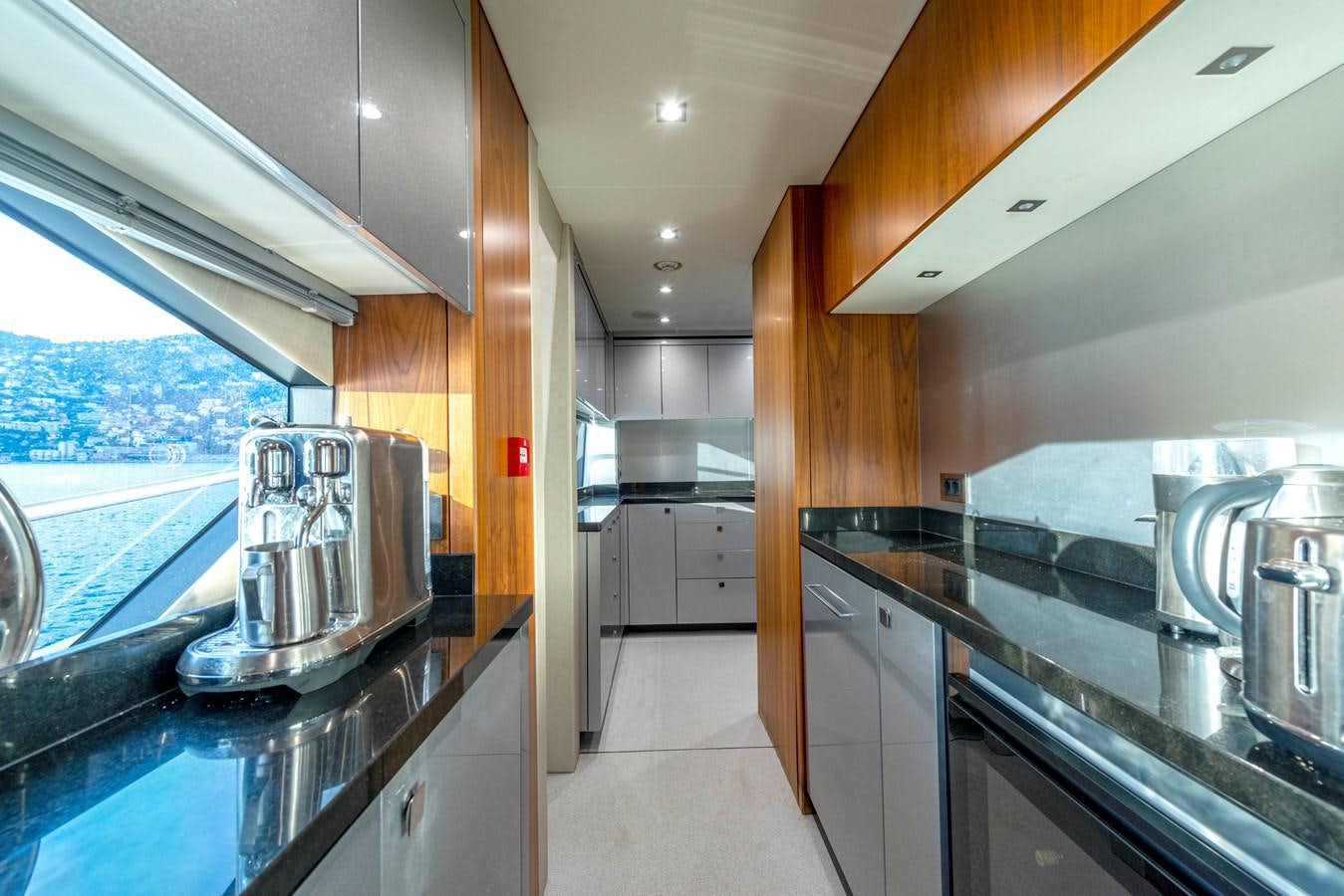 a kitchen with stainless steel appliances aboard TAKE OFF Yacht for Sale