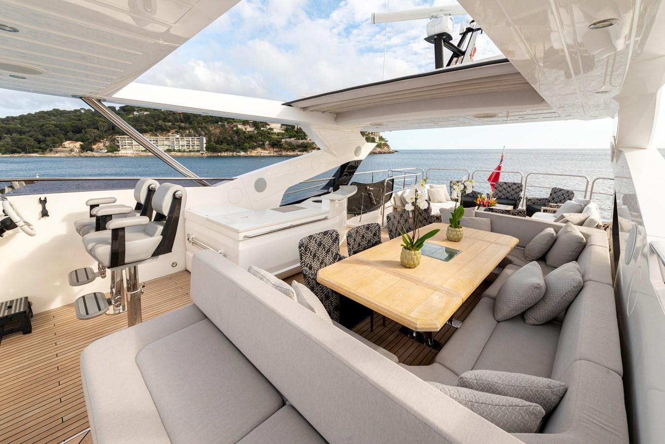 a room with a couch and a table and chairs aboard TAKE OFF Yacht for Sale