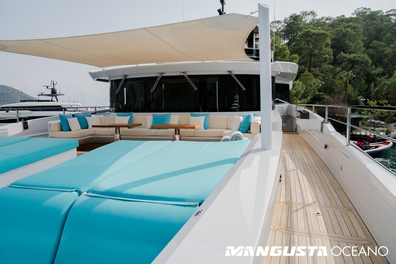 a pool with a deck and a building in the background aboard SANCTUARY Yacht for Sale