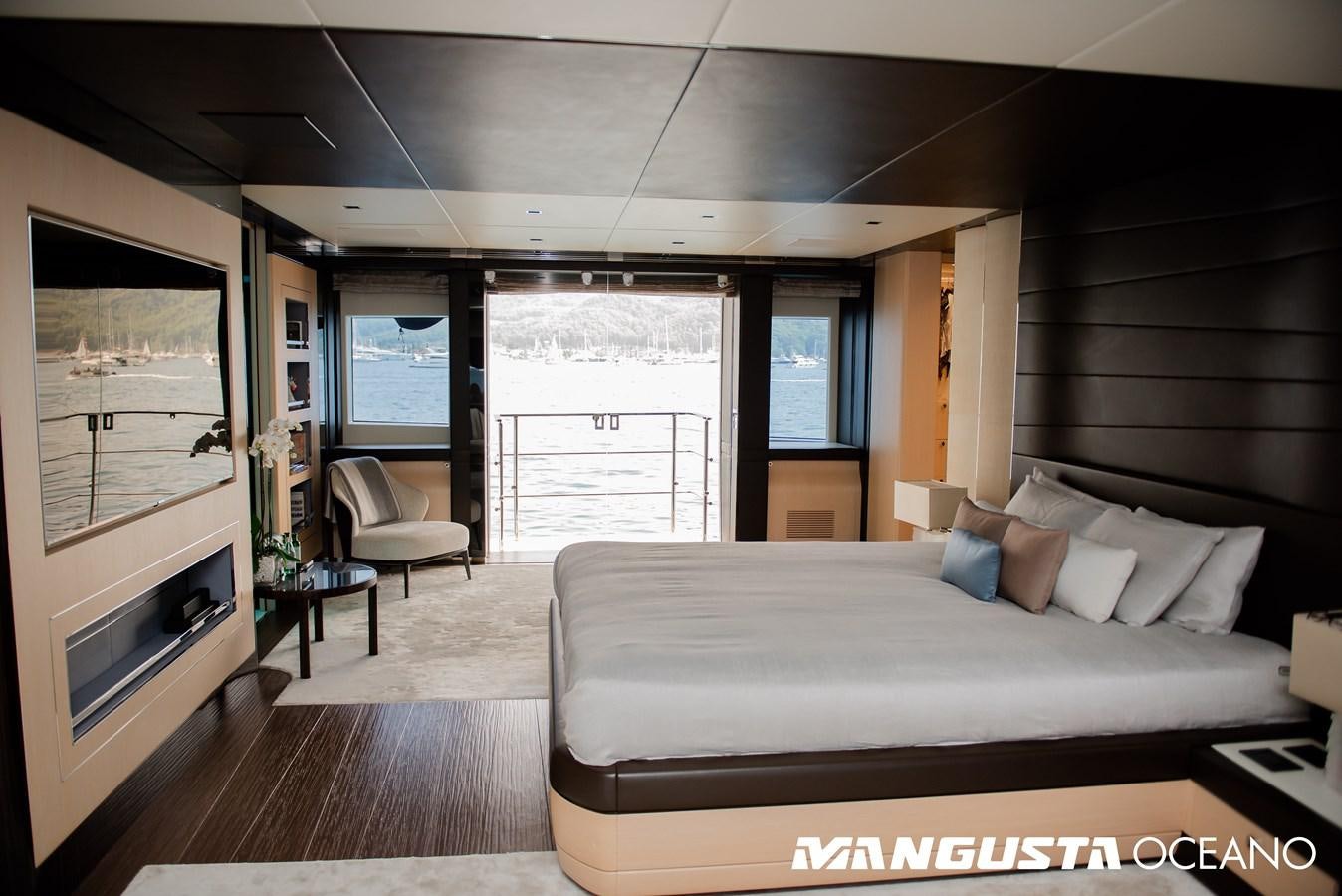 a bedroom with a large window aboard SANCTUARY Yacht for Sale