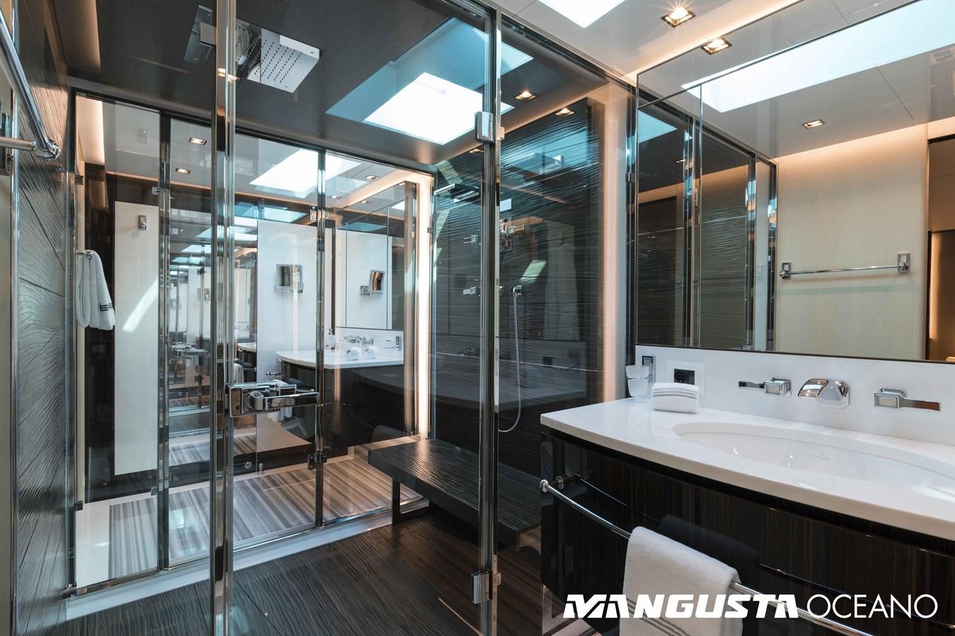 a bathroom with a large mirror aboard SANCTUARY Yacht for Sale