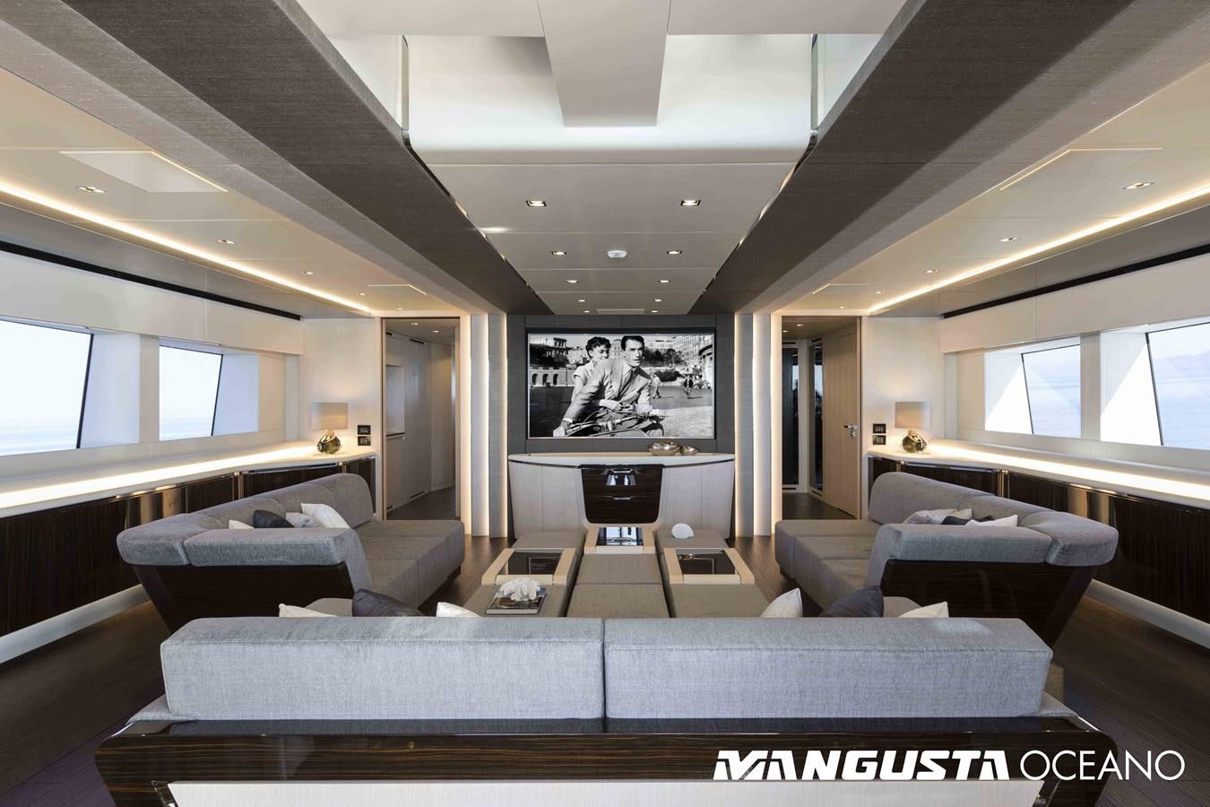 a living room with a large screen aboard SANCTUARY Yacht for Sale