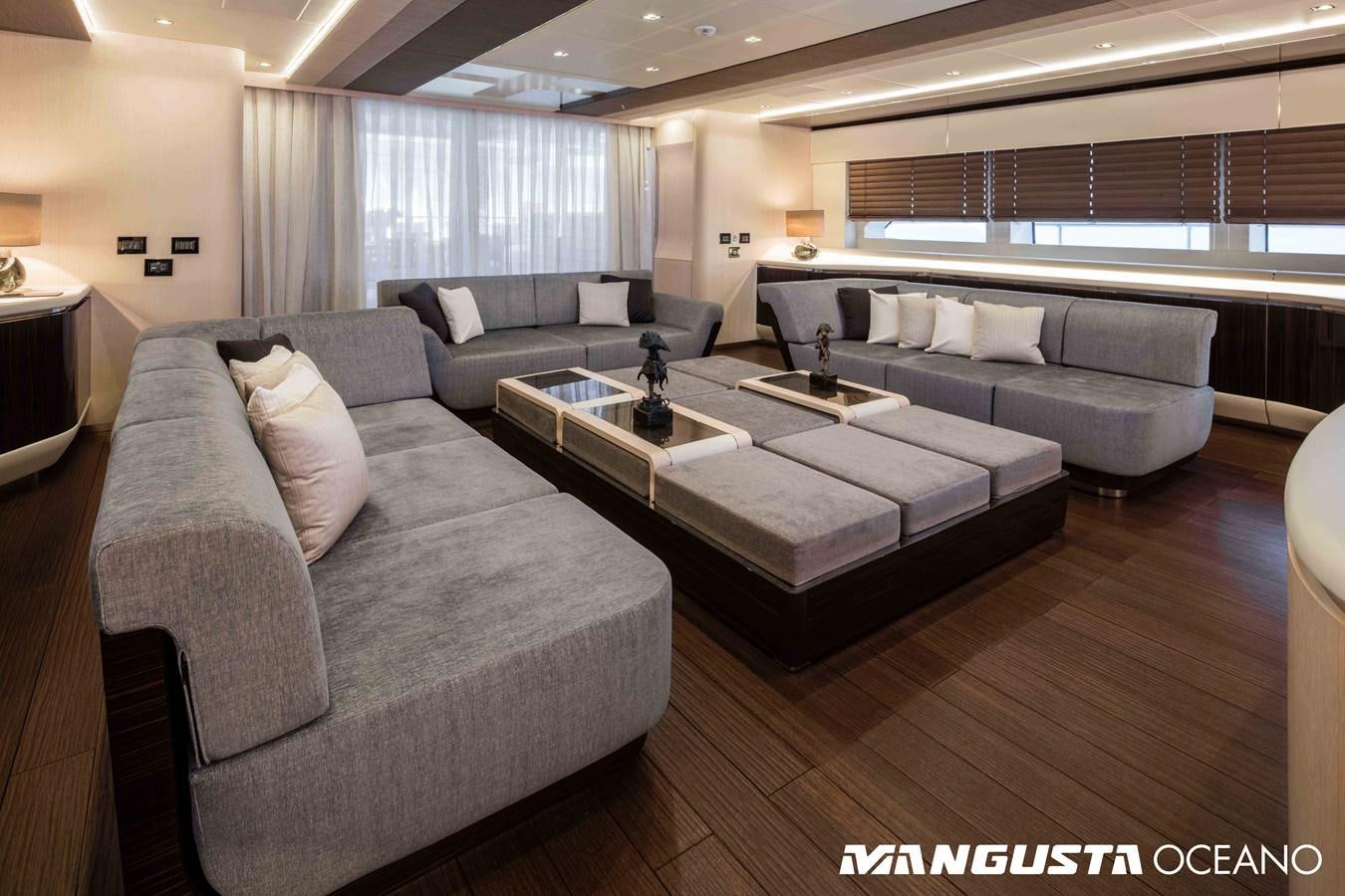 a living room with a couch and a coffee table aboard SANCTUARY Yacht for Sale