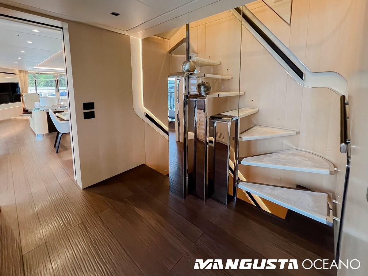 a room with a bed and desk aboard SANCTUARY Yacht for Sale