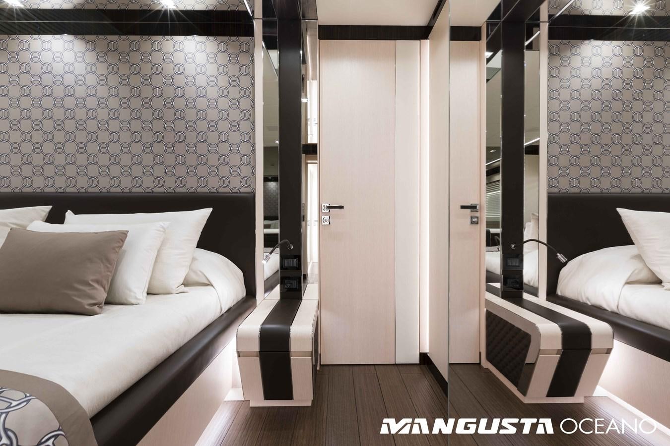 a room with a bed and a mirror aboard SANCTUARY Yacht for Sale