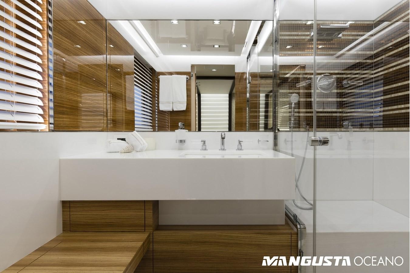 a bathroom with a tub sink and sinks aboard SANCTUARY Yacht for Sale