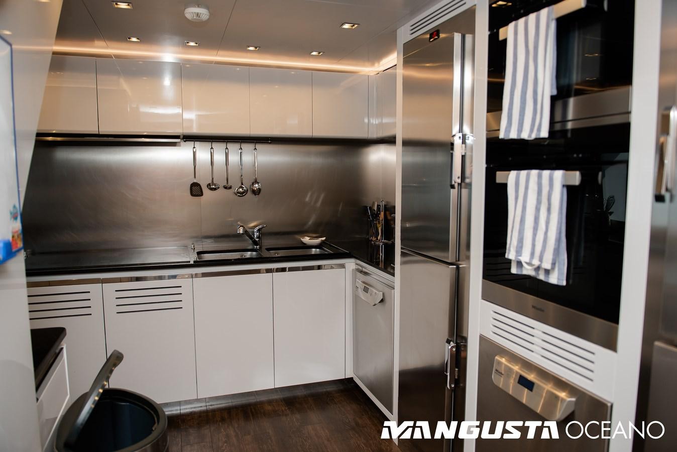 a kitchen with stainless steel appliances aboard SANCTUARY Yacht for Sale