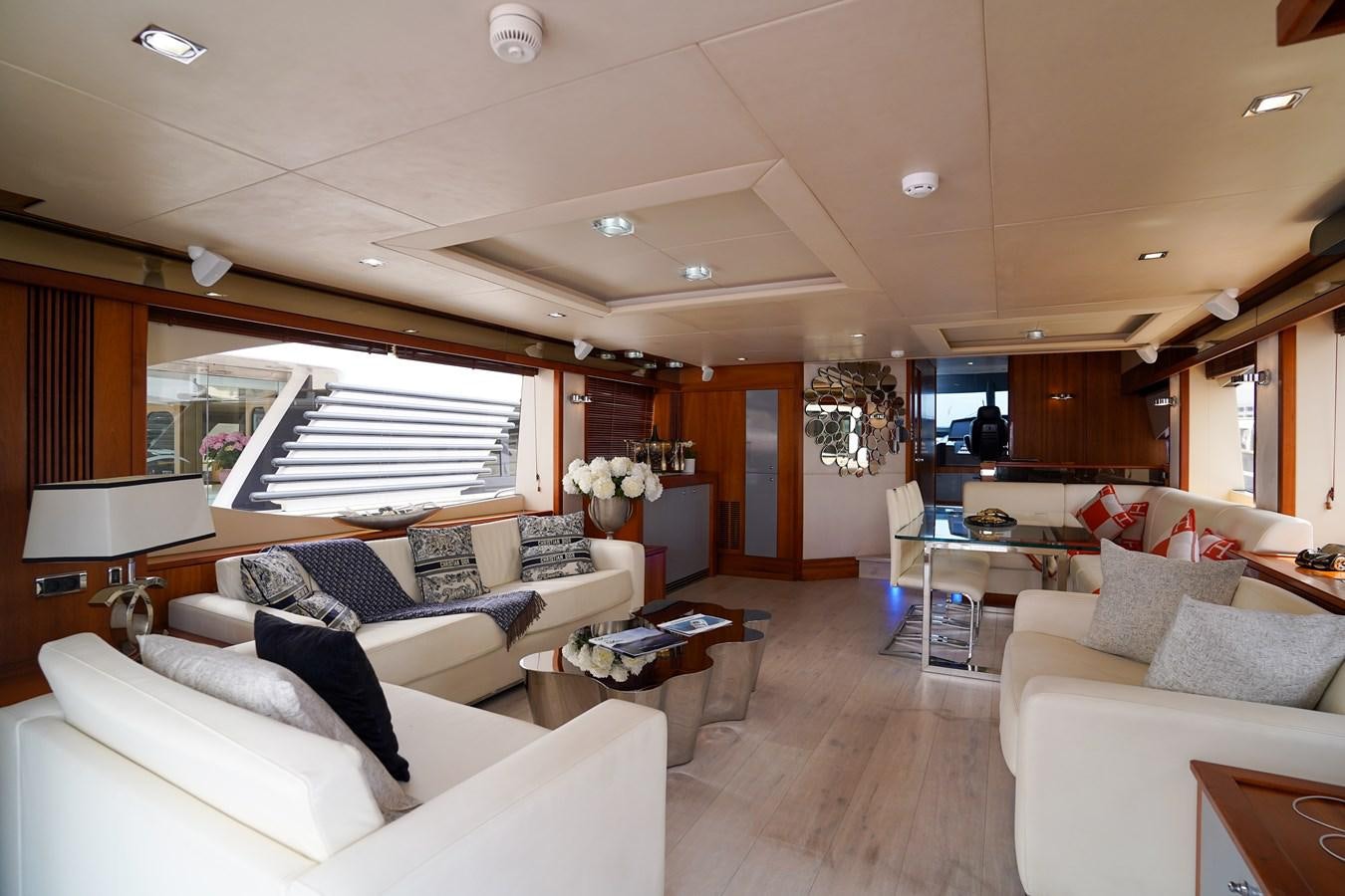 a living room with a large window aboard LIJOR Yacht for Sale