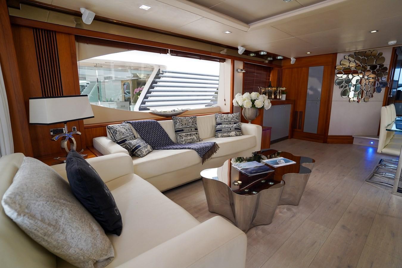 a living room with a large window aboard LIJOR Yacht for Sale